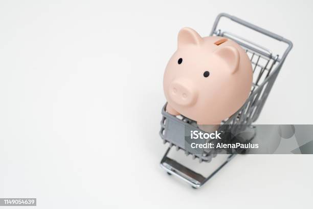 Piggy Bank In Shopping Cart Isolated On White Background Stock Photo - Download Image Now
