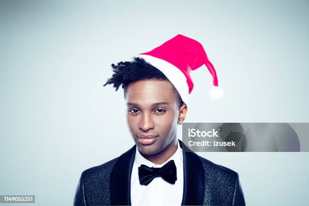 African Man With Santa Hat Stock Photo - Download Image Now - 20-29 Years, Adult, Adults Only