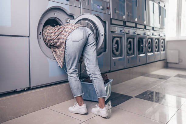 istock Female feet in the washing machine 1149055908