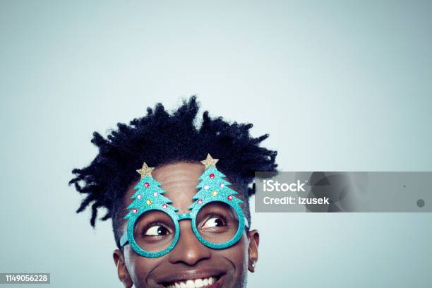 Funny Christmas Portrait Of Young Guy Stock Photo - Download Image Now - Christmas, 20-29 Years, Adult