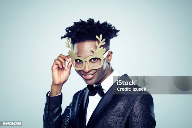 Funny Christmas Portrait Of Young Man Stock Photo - Download Image Now - Antler, Portrait, Humor