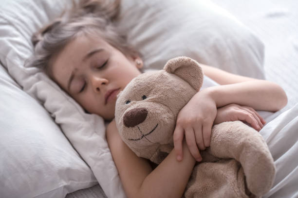istock Little cute girl in bed with toy 1149056465