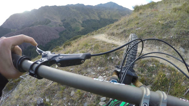 istock POV of bicyclist descending mountain path 1149058570