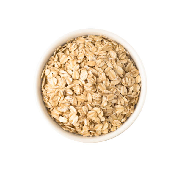 istock Uncooked oat flakes in round ceramic plate 1149059188