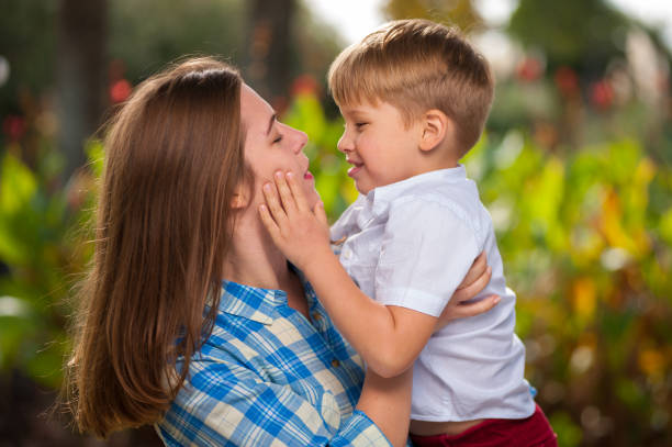 istock Beautiful mother holds in arms a small pretty son 1149059488