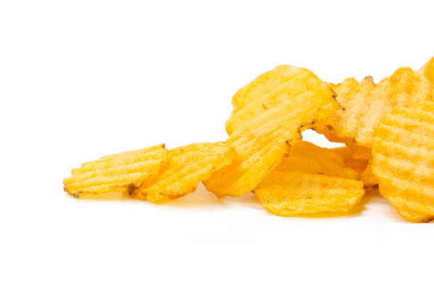 istock yellow potato chips isolated on white 1149060817
