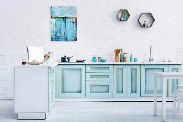 istock interior of modern bright turquoise kitchen with painting on white brick wall 1149062339