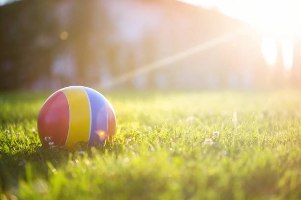 children's rubber ball on the grass. On a Sunny summer day