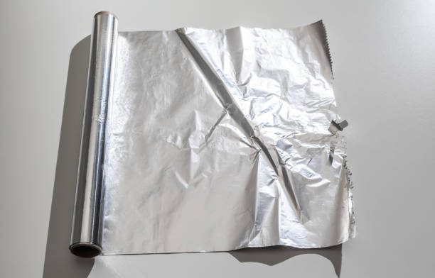 istock roll of aluminum foil isolated on white background 1149064189