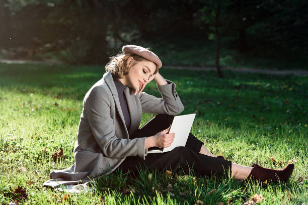 istock Work outdoors benefits. Education technology and internet concept. Girl work with laptop in park sitting on grass. Natural environment office. 1149065905