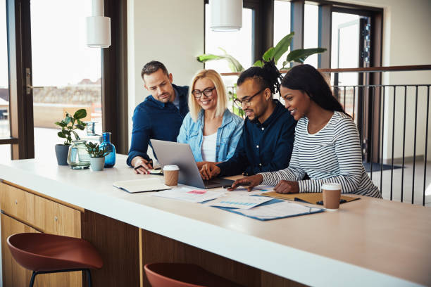 istock Diverse businesspeople working on a laptop in an office 1149066441