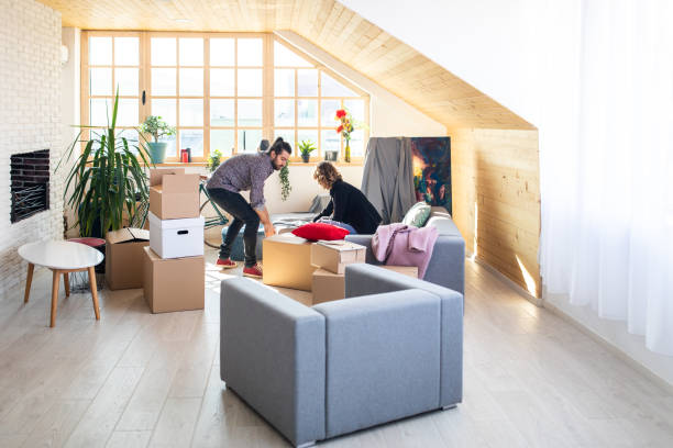 istock Couple packing last box for moving house 1149066649