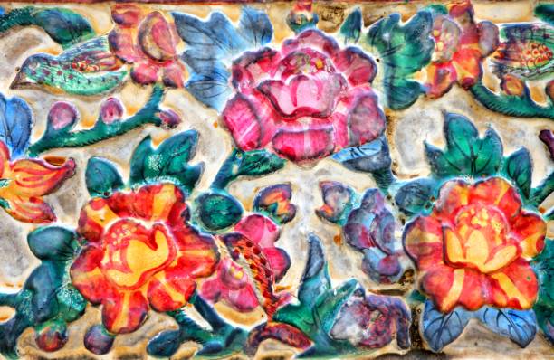 Vintage Thai Sculpture on Stone Wall.