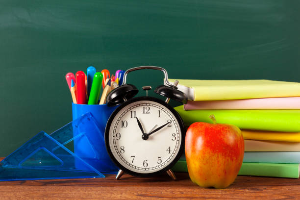 istock back to school - apple and books with pencils and blackboard 1149067864