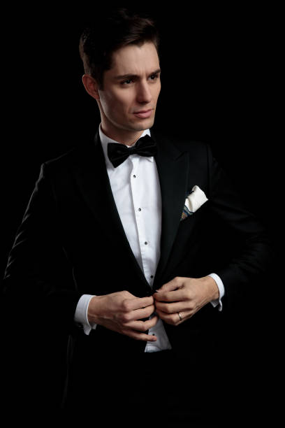 istock fashion serious guy buttoning his lounge jacket while looking away 1149068211