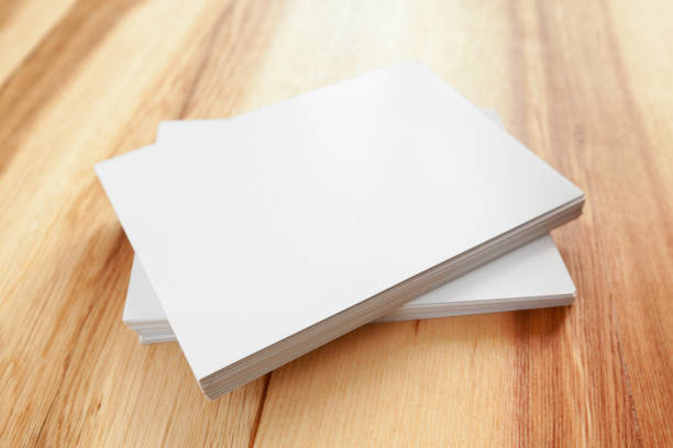 istock Blank paper on wood table 1149068294