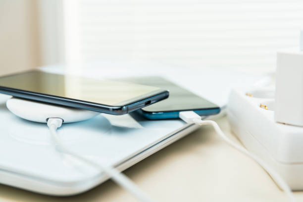 istock Mobile phones on wireless charger 1149069021