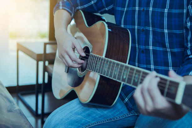 istock close up  of a man playing guitar 1149069635