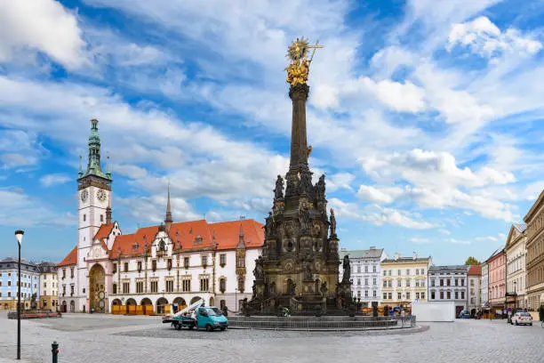 Panorama of the Square and the Holy Trinity Column in Olomouc, Czech Republic under beautiful cloudy sky