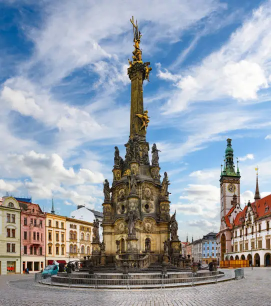 Panorama of the Square and the Holy Trinity Column in Olomouc, Czech Republic under beautiful cloudy sky