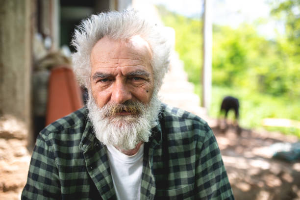 istock Senior retired man relaxing in his backyard on a warm summer day 1149070856