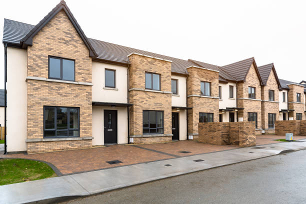 New terraced houses for sale in a residential development Newly built row houses for sale in a Residential district ona cloudy winter day dublin republic of ireland photos stock pictures, royalty-free photos & images