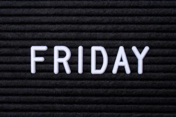 The word FRIDAY, spelt on a letter board.