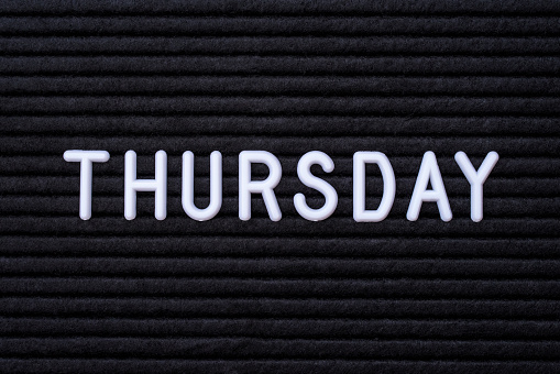 The word THURSDAY, spelt on a letter board.