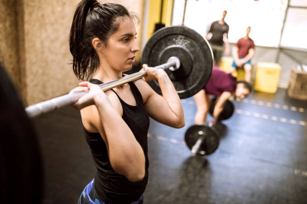 istock Young woman Preparing for Weightlifting 1149073917