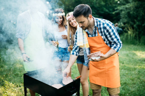istock Group of friends having fun in nature doing bbq 1149074088