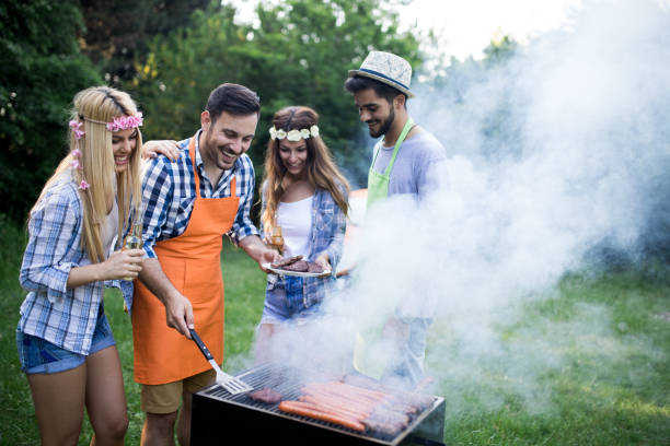 istock Friends having a barbecue party in nature 1149074098