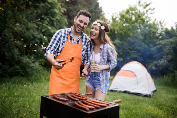 istock Friends having a barbecue party in nature 1149074119