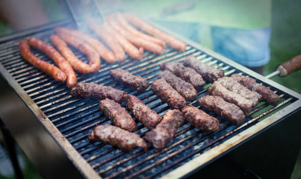 istock Delicious assorted grilled meat with vegetables over the coals on barbecue 1149074132