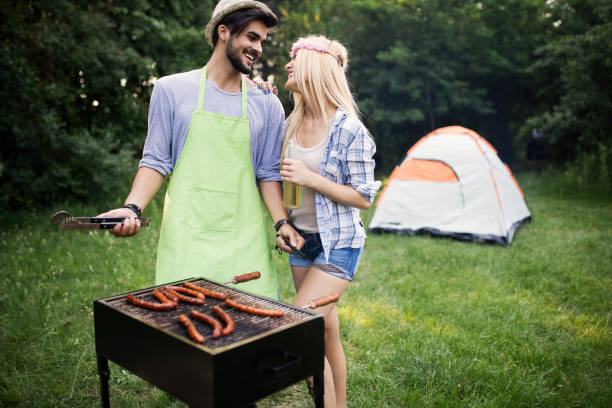 istock Handsome male preparing barbecue outdoors for friends 1149074149