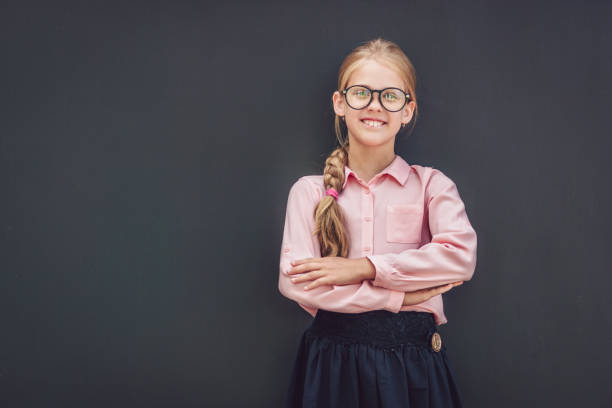 istock Little schoolgirl in uniform 1149074410