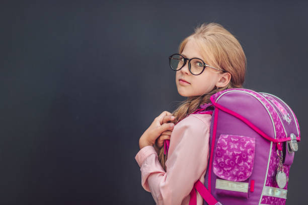 istock Little schoolgirl with a backpack 1149074415