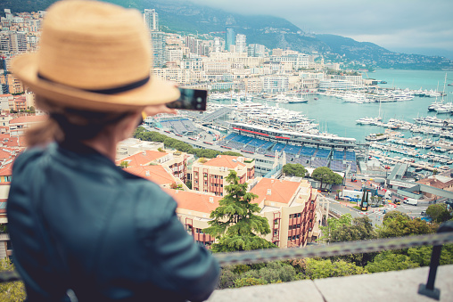 Tourist capturing travel experience in Monaco