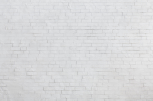 Blurred white brick wall texture for background, empty space