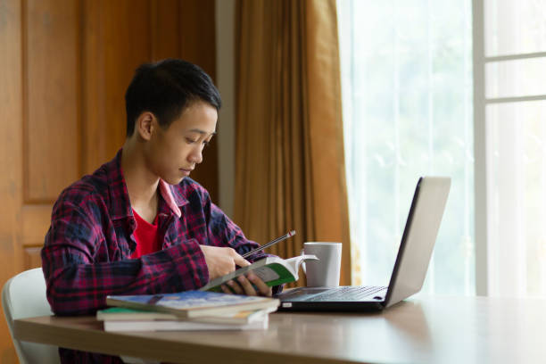 istock Stress student studying at home while use a laptop and mobile phone 1149080057