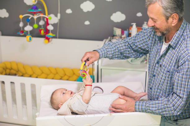 istock Senior man playing with his grandson at home 1149080159