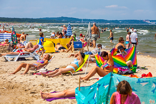 Swinoujscie, Poland - July 7, 2014: People relax on a crowded Baltic sea beach on Usedom island in Swinoujscie city, Poland
