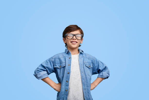 proud confident boy in eyeglasses - hand on hip imagens e fotografias de stock