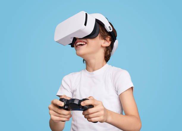istock Cheerful boy playing videogame in VR goggles 1149081635