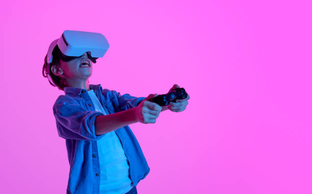 istock Expressive boy playing VR game in glasses 1149081653