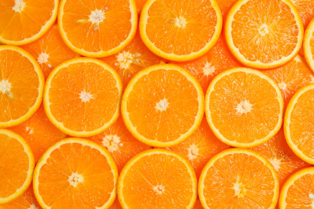 istock Slices of oranges as a background, top view. 1149082250