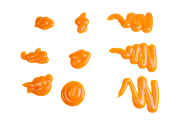 istock Orange sauce splashes isolated on white background 1149082968