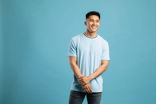 istock Young Man In Front of a Blue Background 1149083787