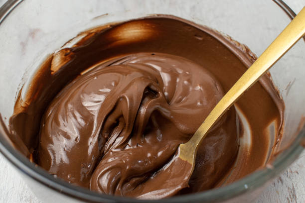 istock glass bowl of melted chocolate with spoon 1149084973