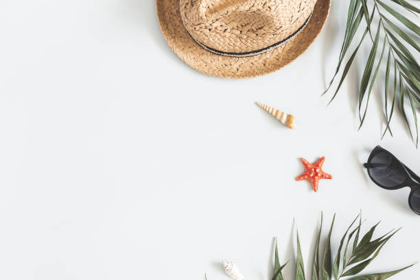istock Summer composition. Tropical palm leaves, hat on gray background. Summer concept. Flat lay, top view, copy space 1149086301