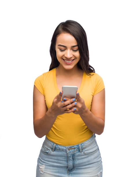 istock Beautiful latin female texting on a smartphone 1149088325
